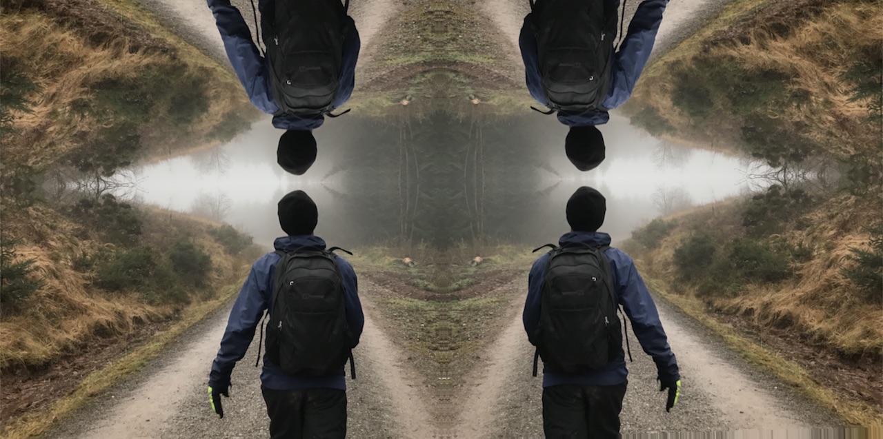 a kaleidoscopic image of a man hiking